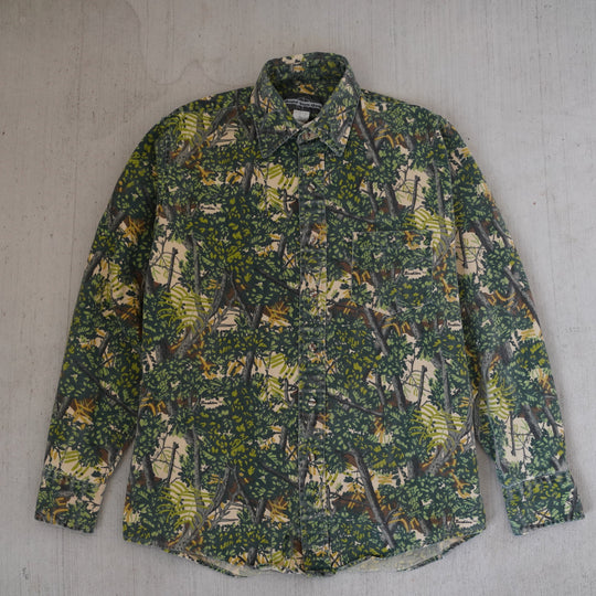 Reworked vintage 1990s Grand Slam Gear forest camo field shirt – handcrafted Wyoming outdoor apparel from the Vintage Wyoming Gear Collection at West Block Vintage.