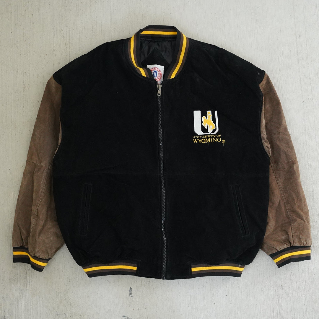 Vintage 1990s Wyoming Cowboys suede and leather varsity jacket with embroidered chest and back logos — Vintage Wyoming Gear Collection, West Block Vintage