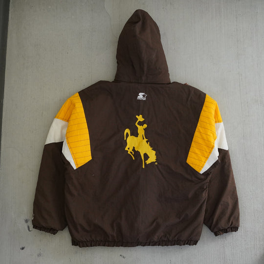 Vintage 1990s Wyoming Cowboys Starter anorak jacket in brown, gold, and white with embroidered logos — Vintage Wyoming Gear Collection, West Block Vintage.
