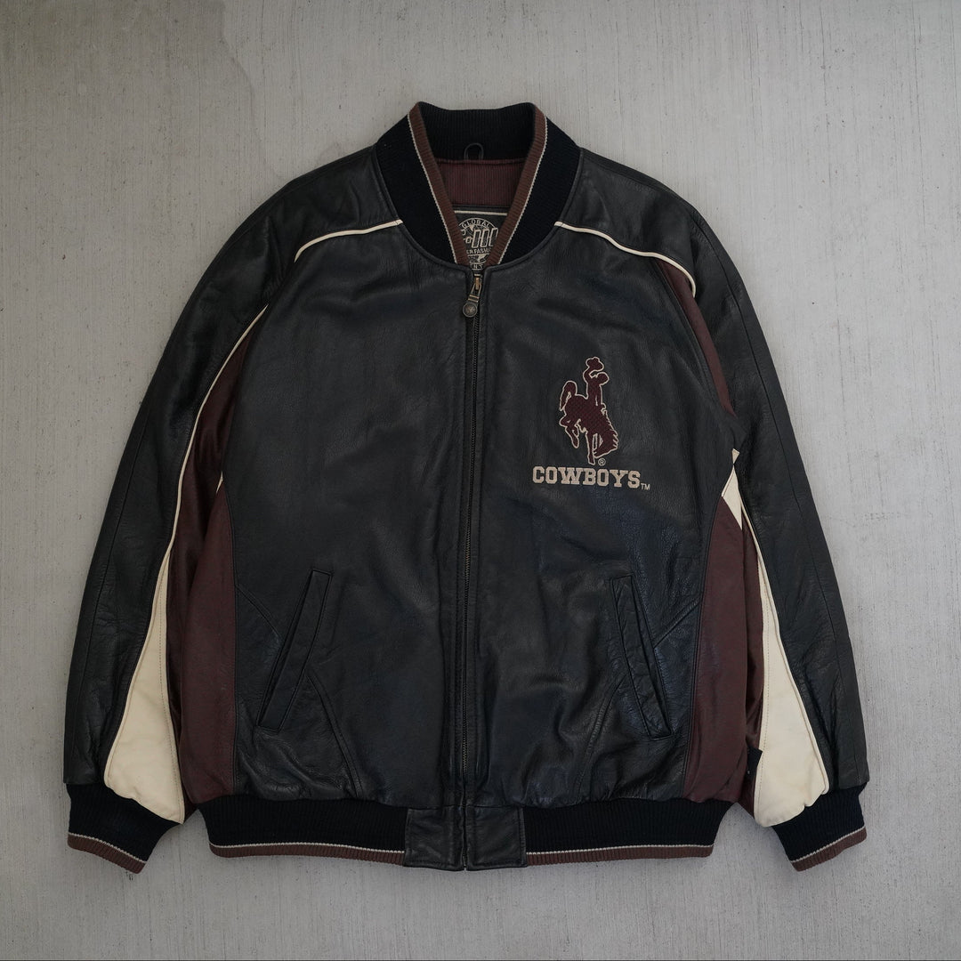 Y2K Wyoming Cowboys full leather jacket in black, maroon, and cream color blocking, size XL, photographed front and back. Vintage sourced, cleaned, and restored in Wyoming. West Block Vintage.