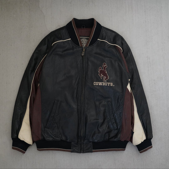 Y2K Wyoming Cowboys full leather jacket in black, maroon, and cream color blocking, size XL, photographed front and back. Vintage sourced, cleaned, and restored in Wyoming. West Block Vintage.