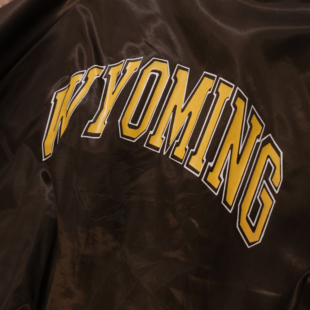 Close-up of large arched Wyoming lettering on back of vintage satin bomber jacket