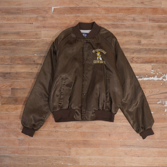 1980s brown Wyoming Cowboys satin bomber jacket, front with snap closures and small mascot chest print