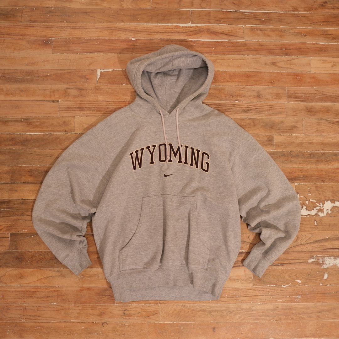 Mid-2000s heather gray Nike Wyoming Cowboys pullover hoodie with embroidered arch lettering and center Swoosh