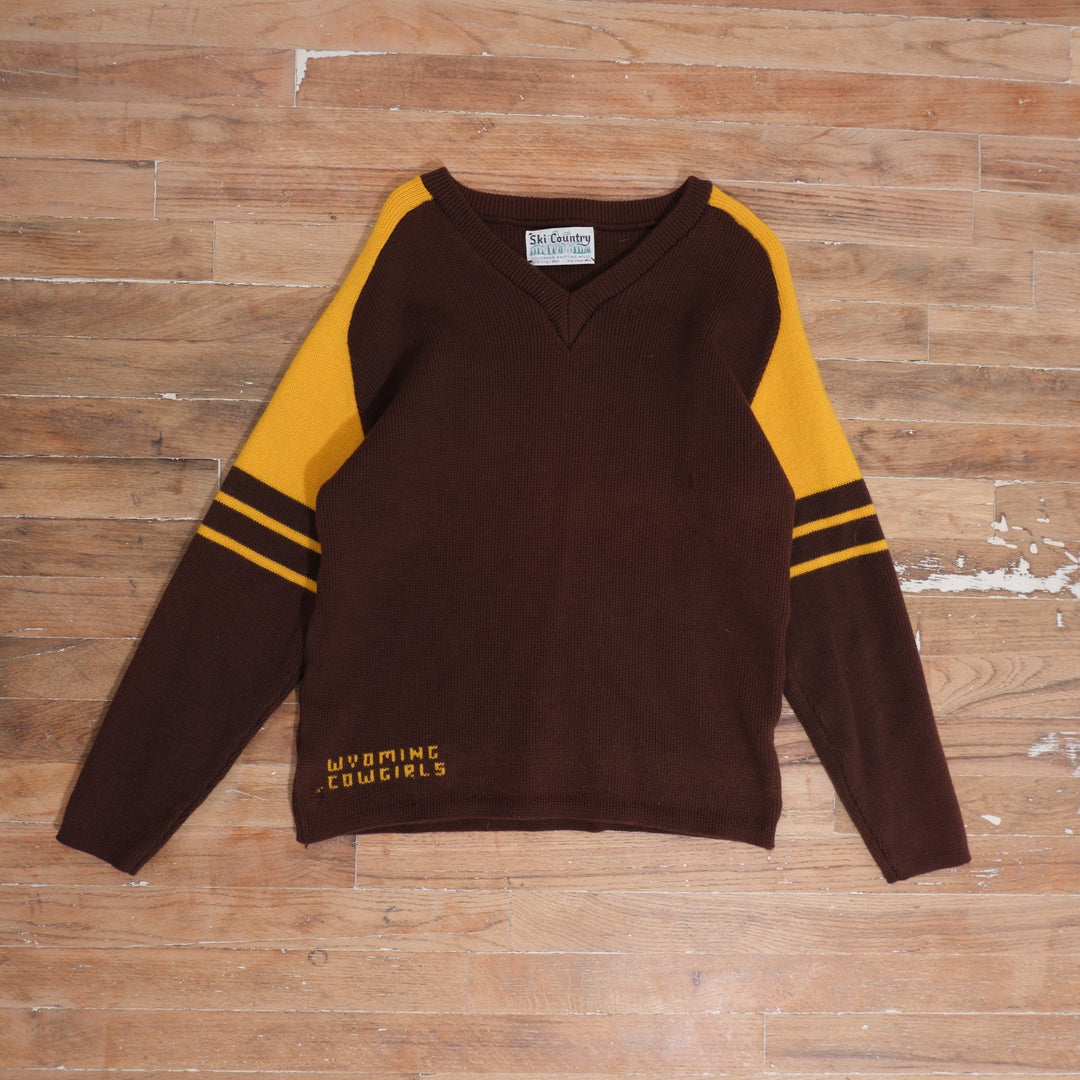 1970s brown / gold 70s Wyoming Cowgirls Virgin Wool Brown Gold Sweater photographed flat on wood floor