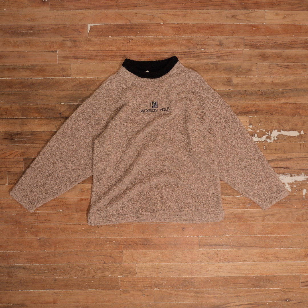 1990s beige / black Jackson Hole Beige Sherpa Fleece Crewneck photographed flat on wood floor