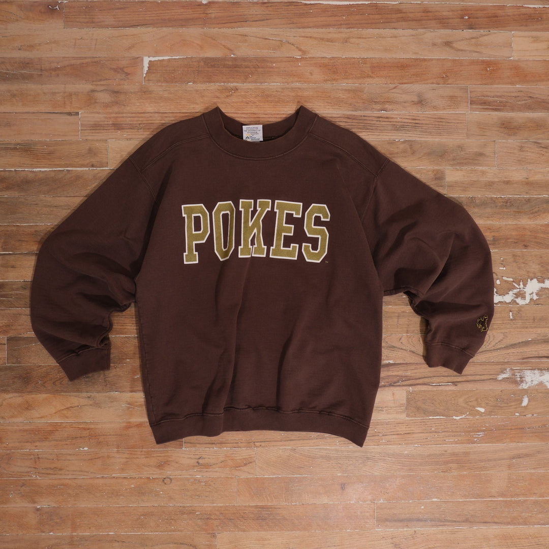 1990s faded brown Wyoming Pokes Brown Heavyweight Crewneck photographed flat on wood floor