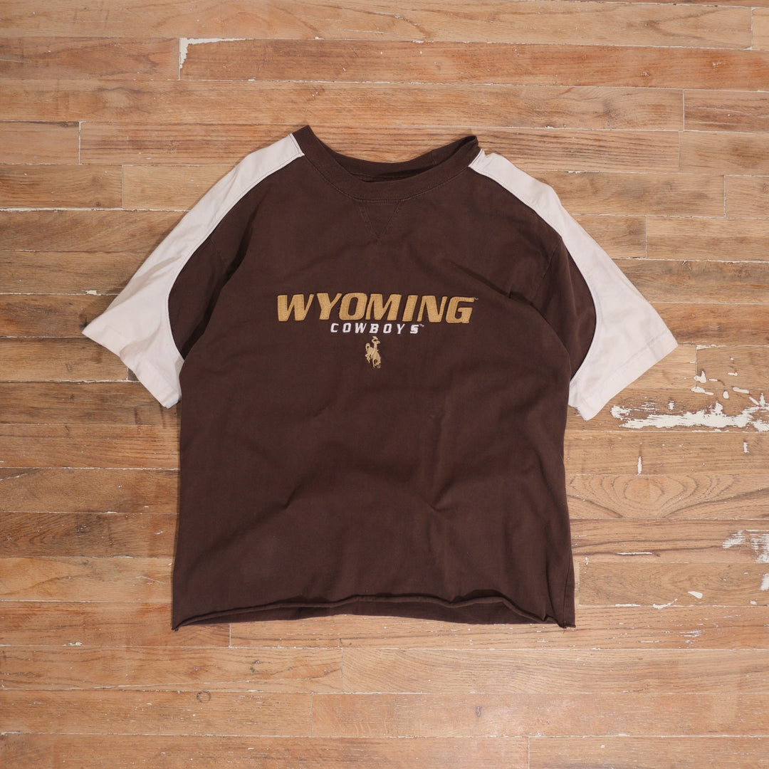 Y2K brown / cream / gold Wyoming Cowboys Brown Colorblock Cropped Crewneck photographed flat on wood floor