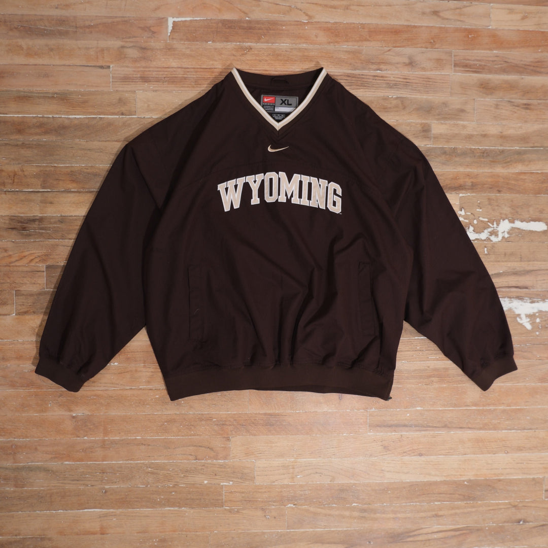 Mid-2000s Wyoming Cowboys brown / white windbreaker nike wyoming cowboys center swoosh brown windbreaker front flat lay