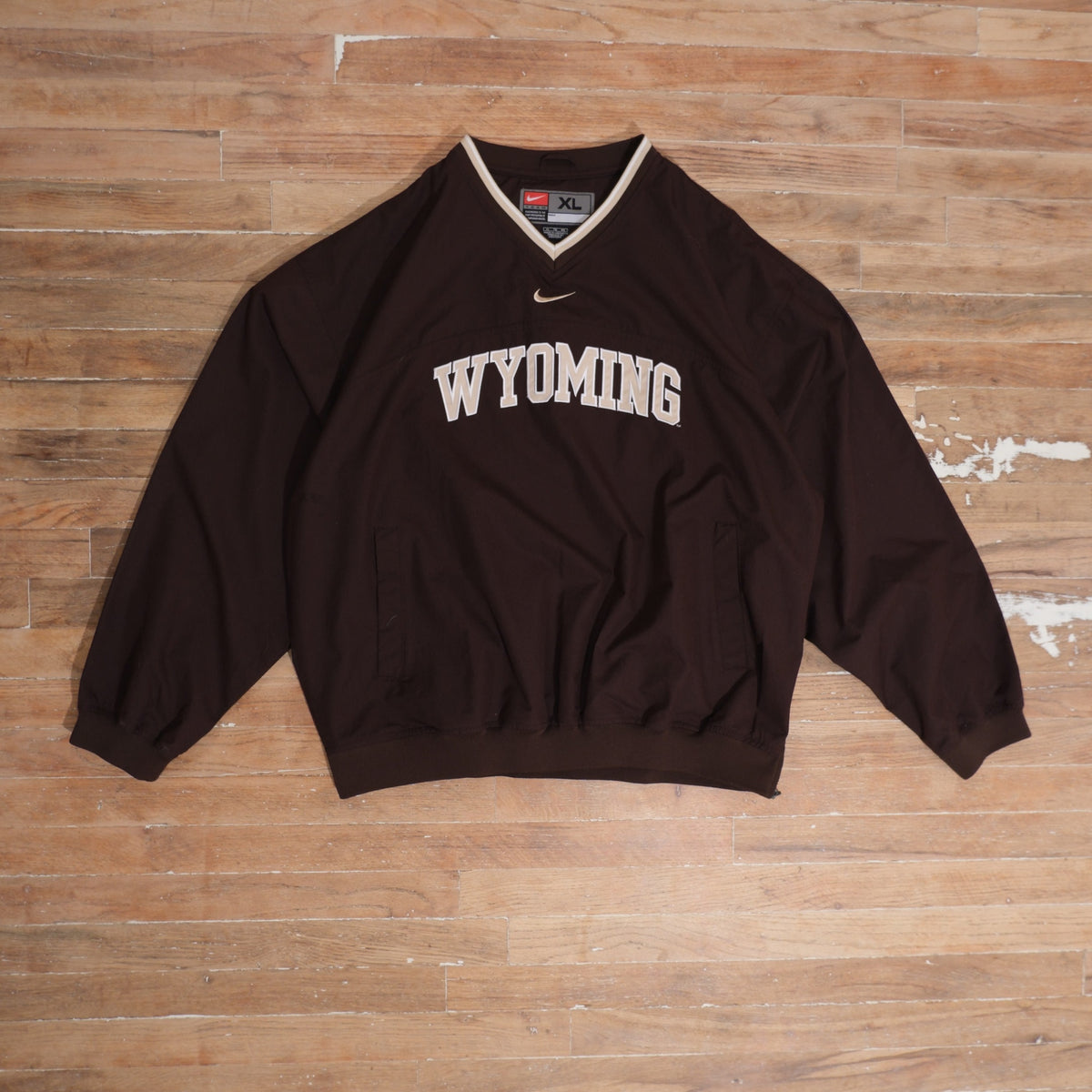 Mid-2000s Wyoming Cowboys brown / white windbreaker nike wyoming cowboys center swoosh brown windbreaker front flat lay