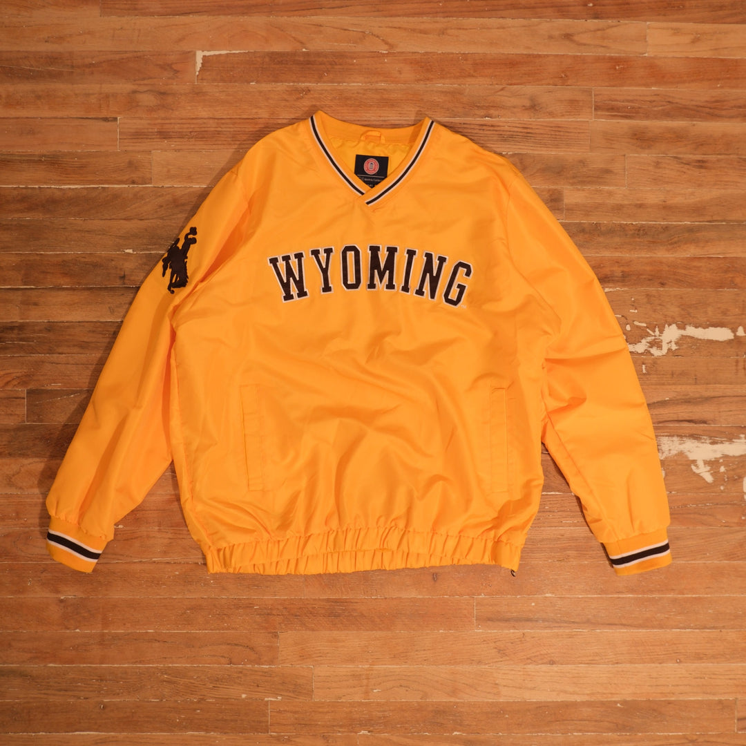 Mid-2000s Wyoming Cowboys gold / brown / white windbreaker wyoming cowboys gold steamboat v-neck windbreaker front flat lay