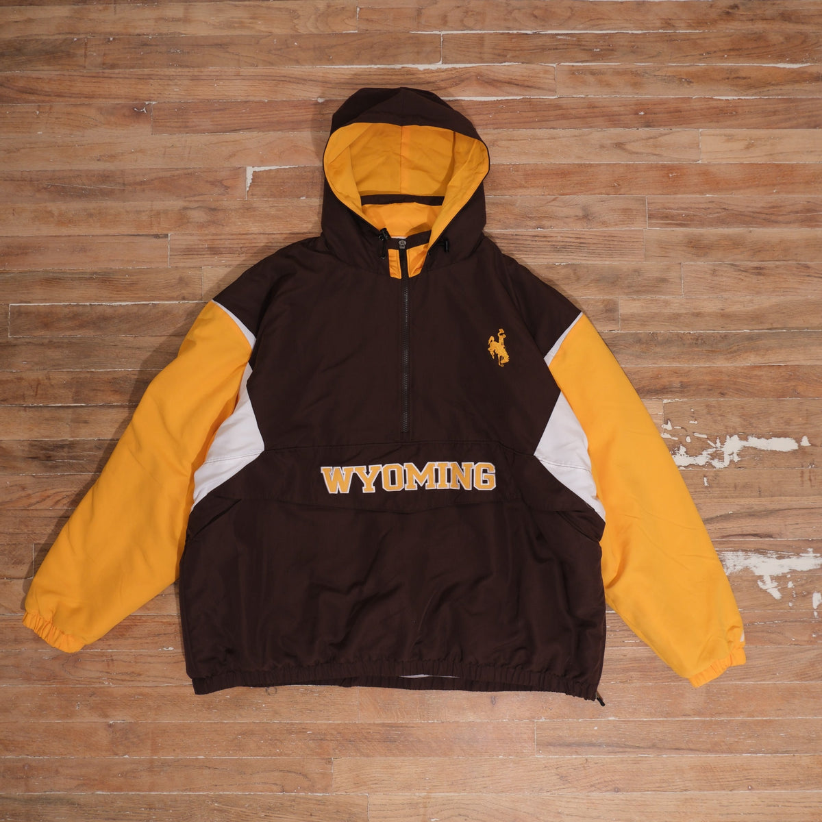 Mid-2000s Wyoming Cowboys brown / gold / white anorak jacket wyoming cowboys brown gold colorblock heavyweight anorak jacket front flat lay