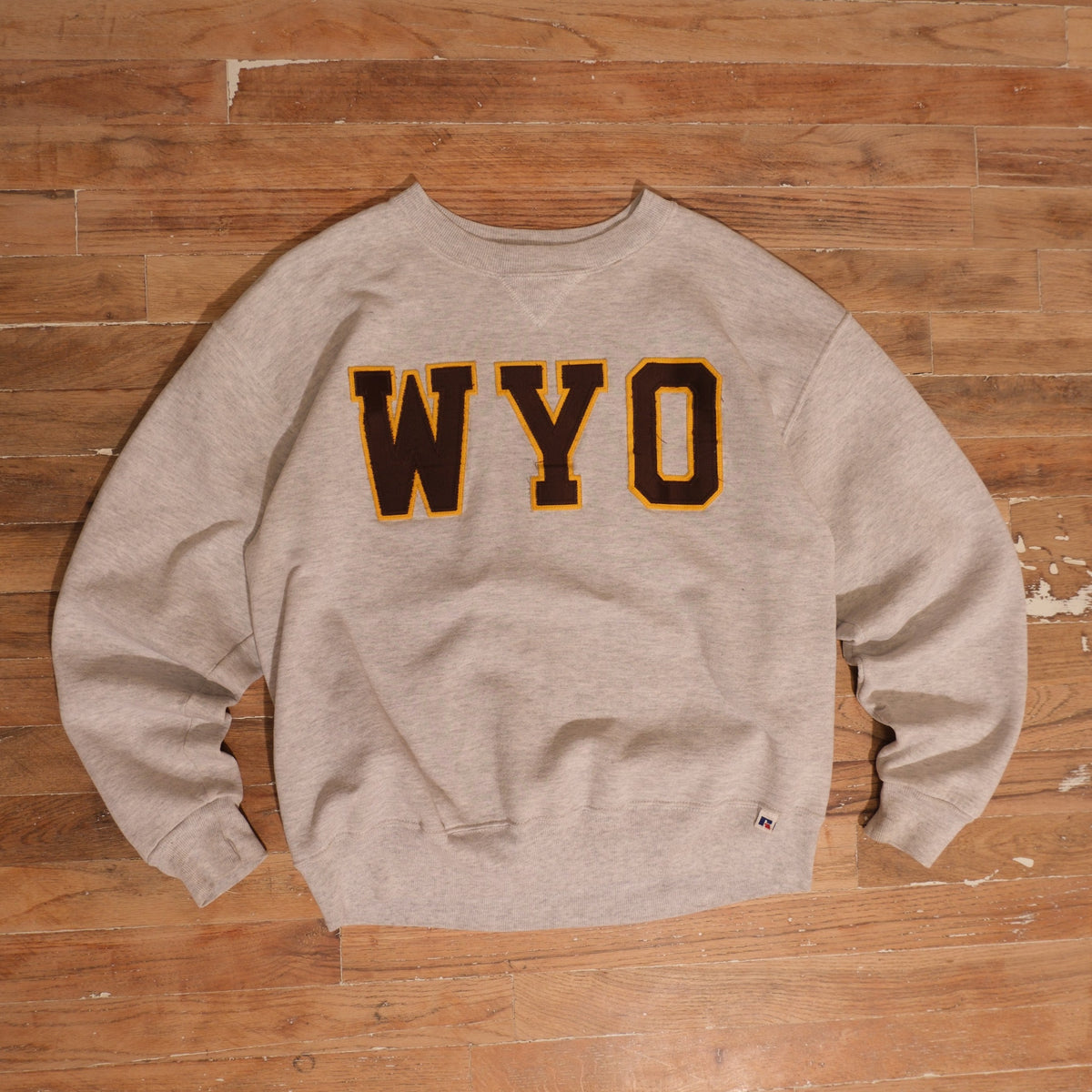 1990s Wyoming Cowboys heather gray / brown / gold crewneck russell athletic usa made wyo collegiate letter crewneck front flat lay