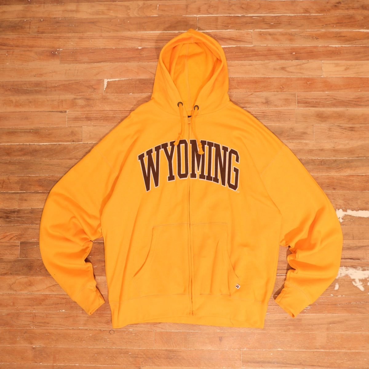 Mid-2000s Wyoming Cowboys gold / brown / white full zip hoodie wyoming cowboys gold arched logo full zip hoodie front flat lay