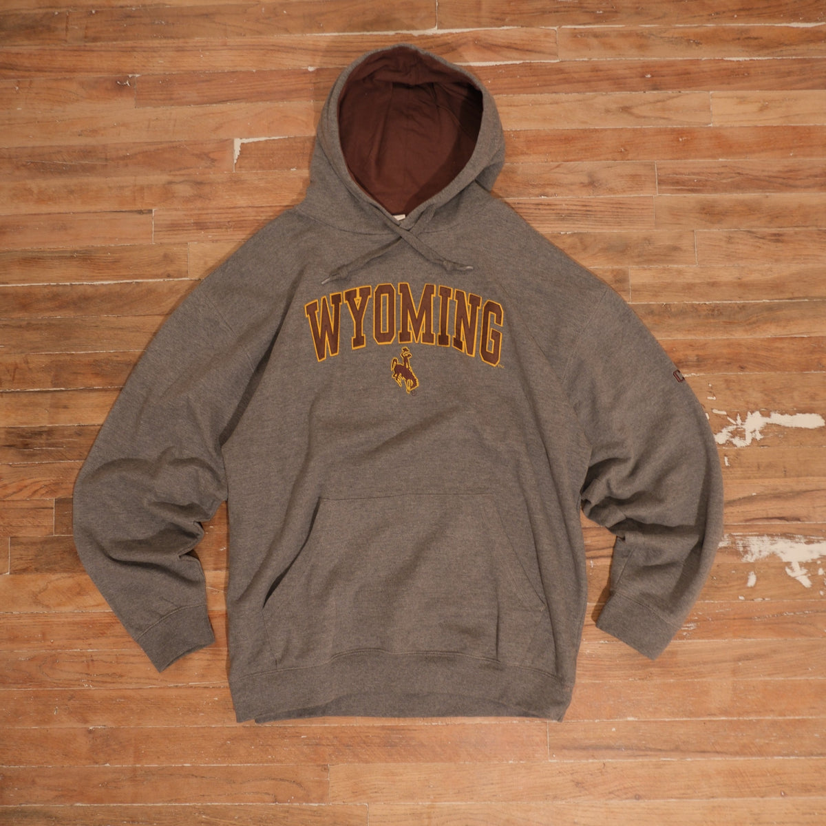Mid-2000s Wyoming Cowboys heather gray / brown / gold hoodie wyoming cowboys heather gray contrast hood embroidered hoodie front flat lay