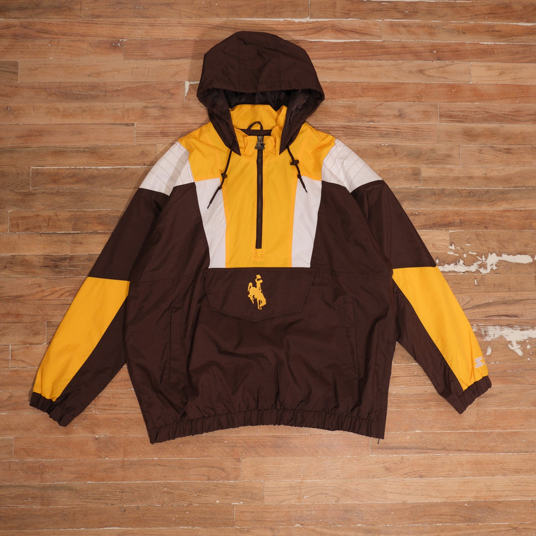 Mid-2000s Wyoming Cowboys brown / gold / white anorak windbreaker starter wyoming cowboys brown gold colorblock anorak windbreaker front flat lay