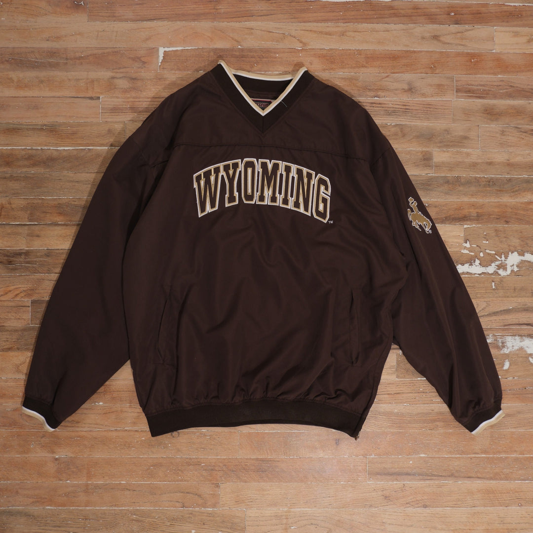 Mid-2000s Wyoming Cowboys brown / gold / cream pullover windbreaker wyoming cowboys brown arched logo v-neck windbreaker front flat lay