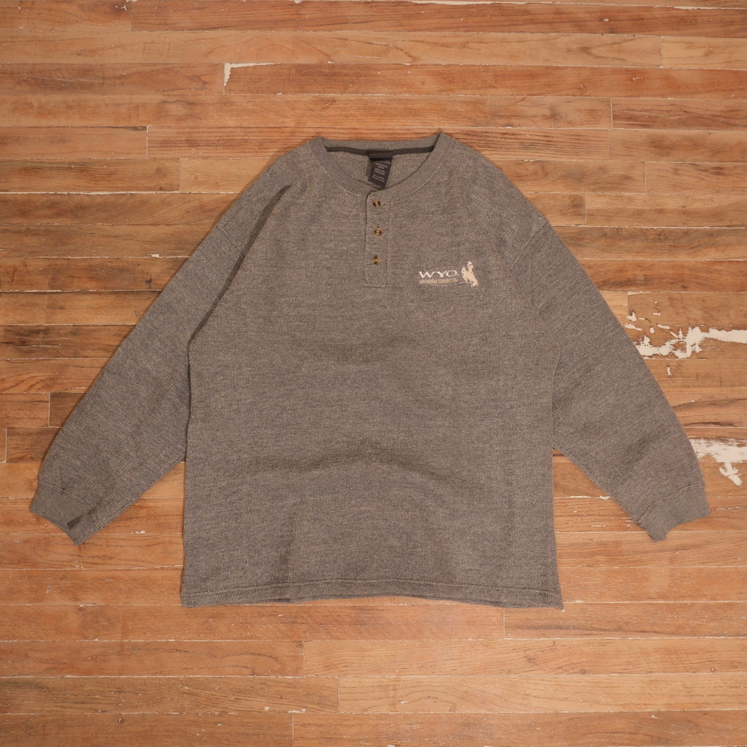 Y2K Wyoming Cowboys gray waffle-knit Henley sweatshirt with three-button neckline, embroidered WYO and Steamboat chest logo, and ribbed cuffs.