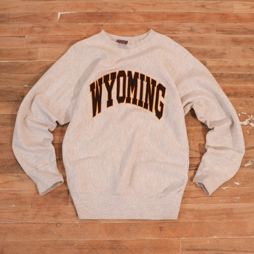 1990s heather gray University of Wyoming reverse weave heavyweight crewneck with brown and gold arched Wyoming lettering
