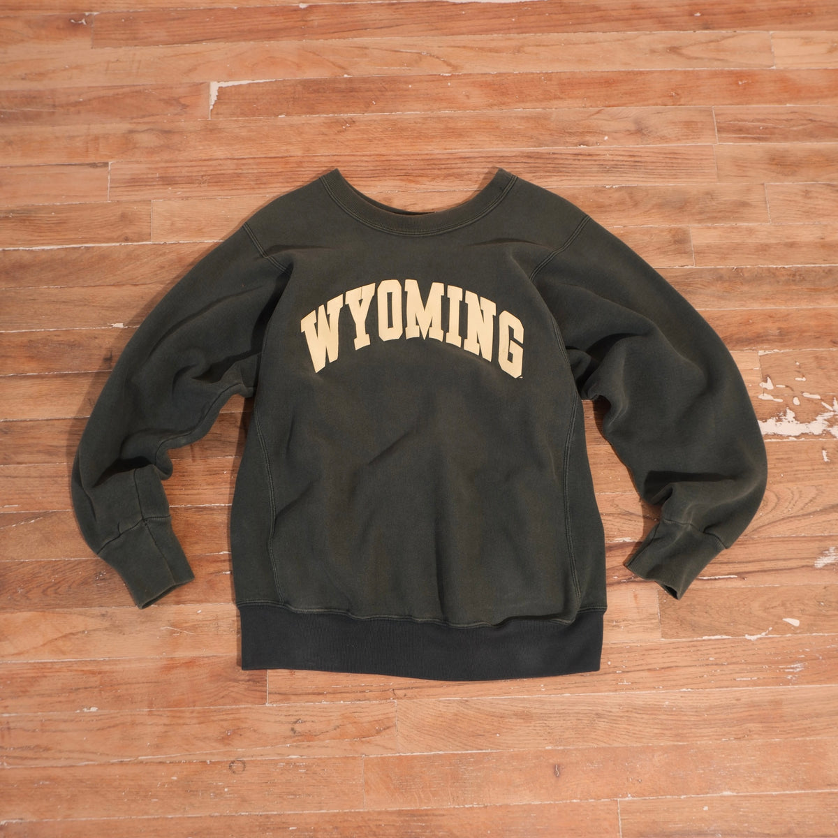 Early 1990s forest green University of Wyoming heavyweight crewneck with cream arched Wyoming screen print