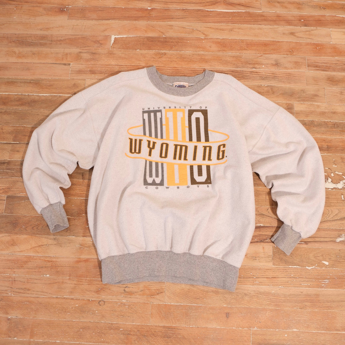 1990s off-white Wyoming Cowboys heavyweight crewneck with multicolored WYO Wyoming graphic and gray ribbed trim