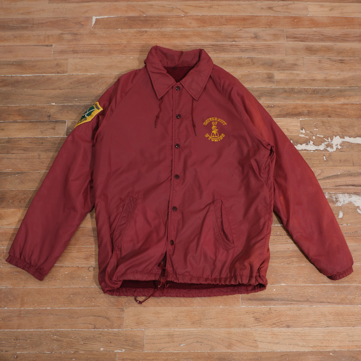 Vintage 1970s Champion University of Wyoming Hockey Club Windbreaker Jacket in red, front view