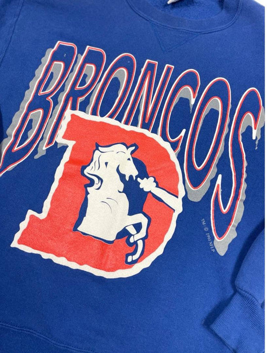 1980s Broncos Russell crewneck sweatshirt from West Block Vintage, featuring classic team branding and a comfortable fit. Ideal for vintage crewneck collectors and Denver Broncos enthusiasts.